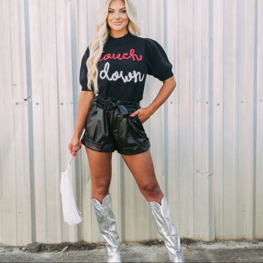 These three boutique Cropped puff sleeved “touch down sweater”